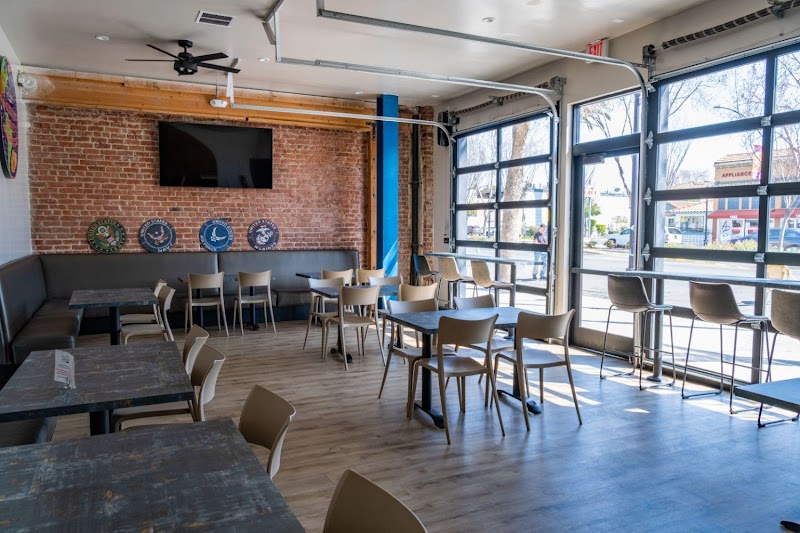 The warm interior of Cafe Rosalena with brick walls and inviting atmosphere